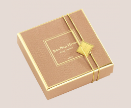 golden square of milk chocolate almonds - closed box